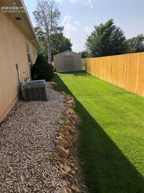 Image 7 of 28: Side with new fence and Tuff Shed 12x16
