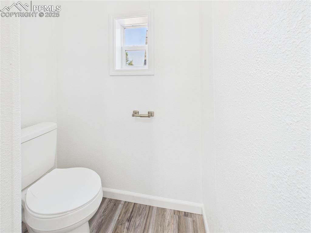 Image 26 of 49: Water Closet – Private water closet area within the primary suite, complete
