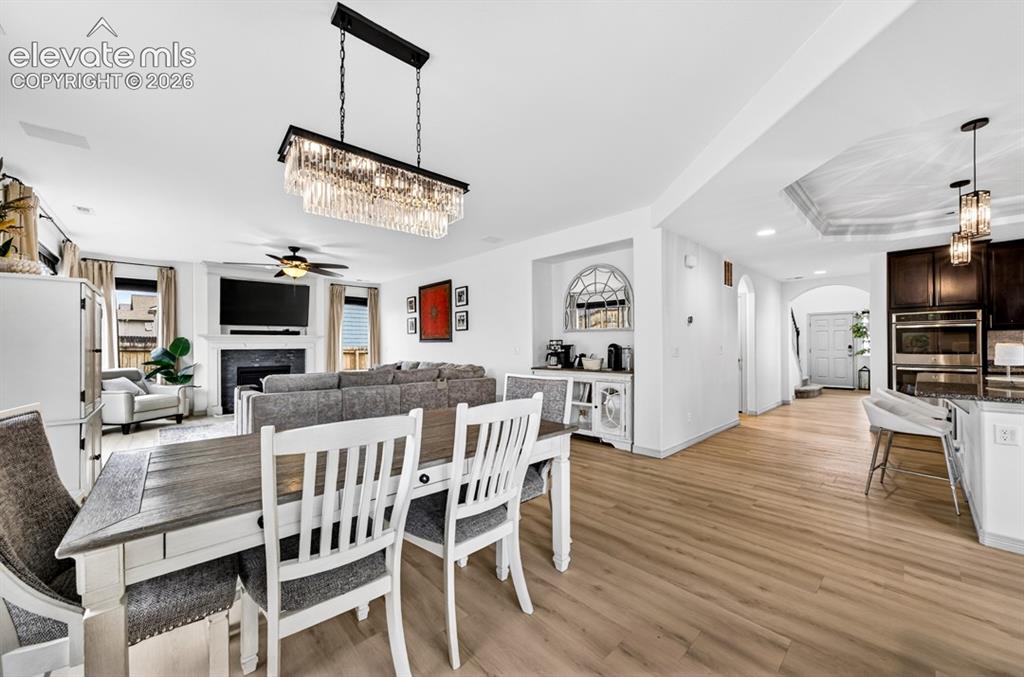 Image 18 of 50: Walk out to backyard, luxury vinyl, chandelier