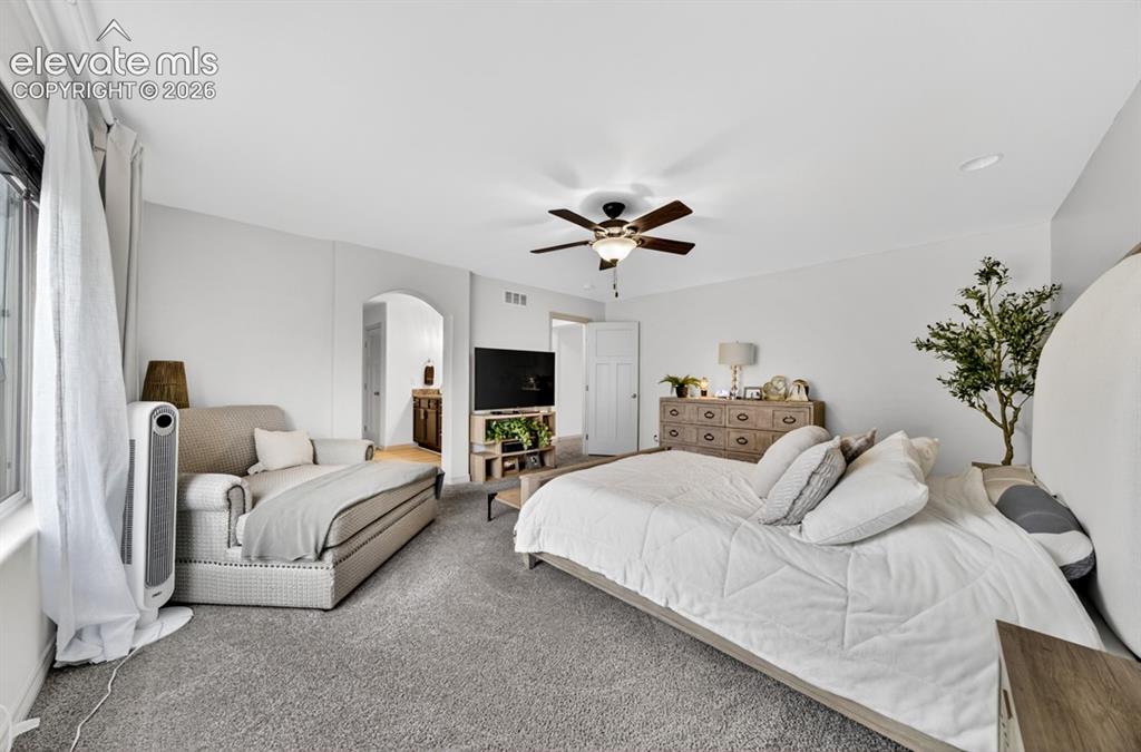 Image 25 of 50: New carpet, oversized room, ceiling fan, adjoining bath, oversized walk-in