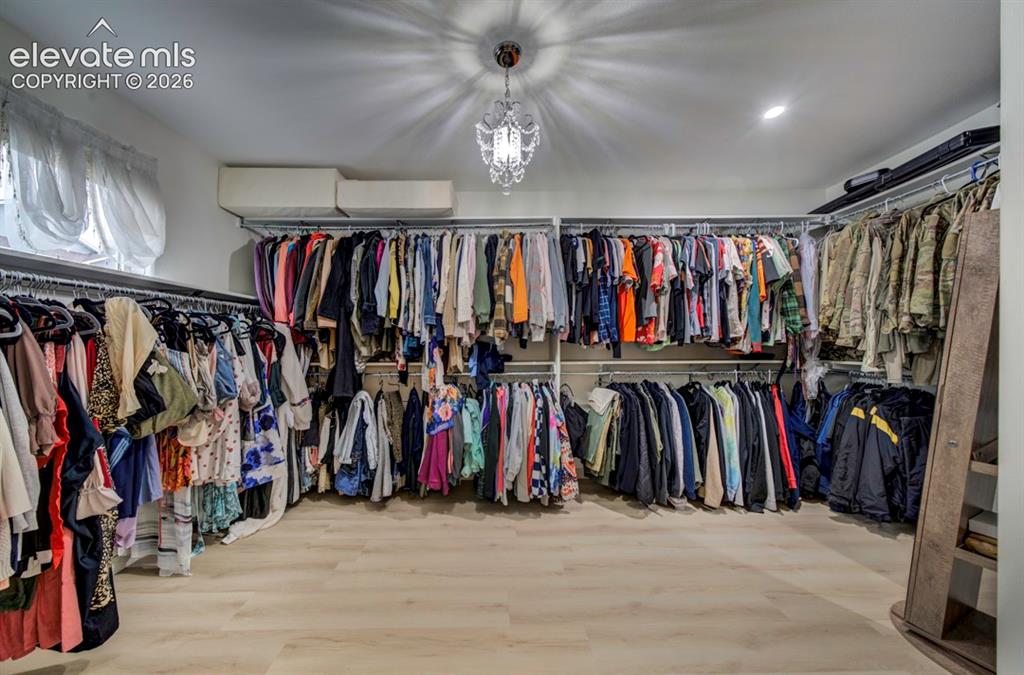 Image 28 of 50: Primary oversized walk-in closet