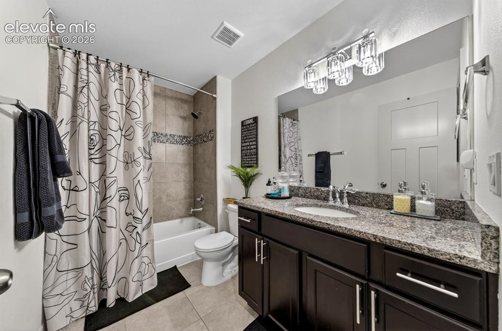 Image 36 of 50: Upper level, granite, full bathroom