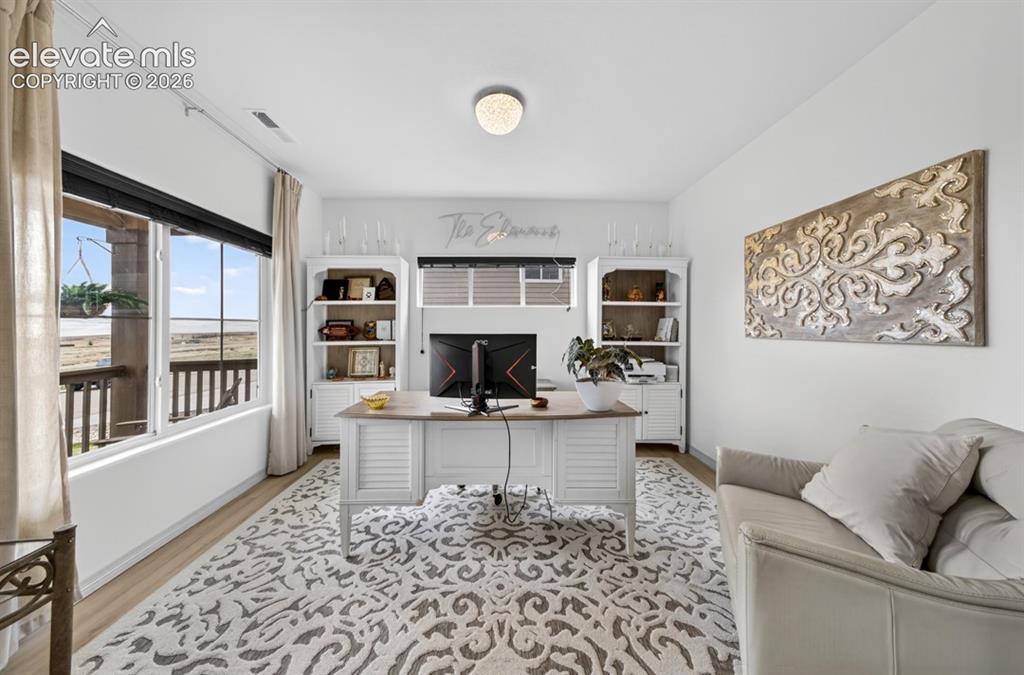 Image 5 of 50: Luxury vinyl, large windows, view of front, main level