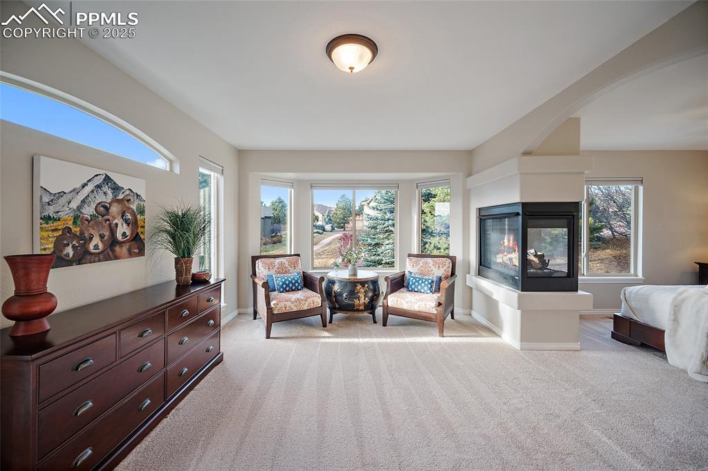 Image 22 of 50: Sitting area in the primary suite. 