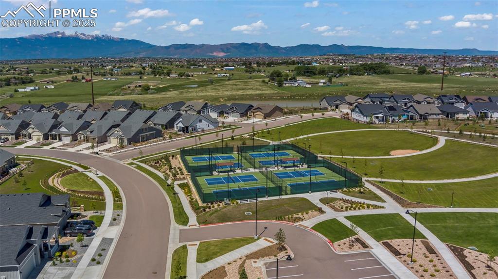 Image 35 of 43: Aerial perspective of suburban area with a mountain backdrop