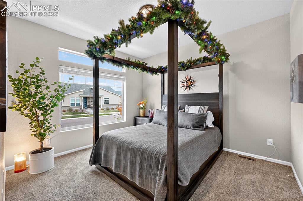 Image 7 of 43: Carpeted bedroom featuring baseboards