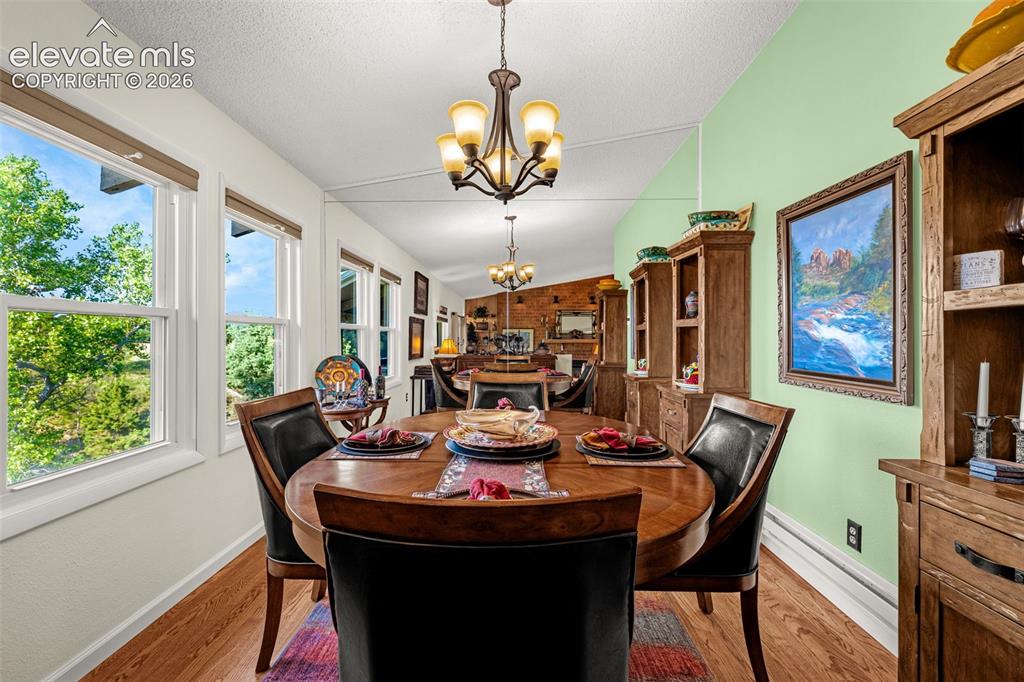 Image 11 of 21: Separate dining area with views of the lake