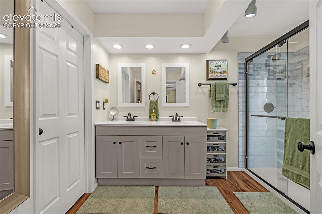 Image 14 of 21: Modern ensuite includes double vanity, glass shower and separate WC