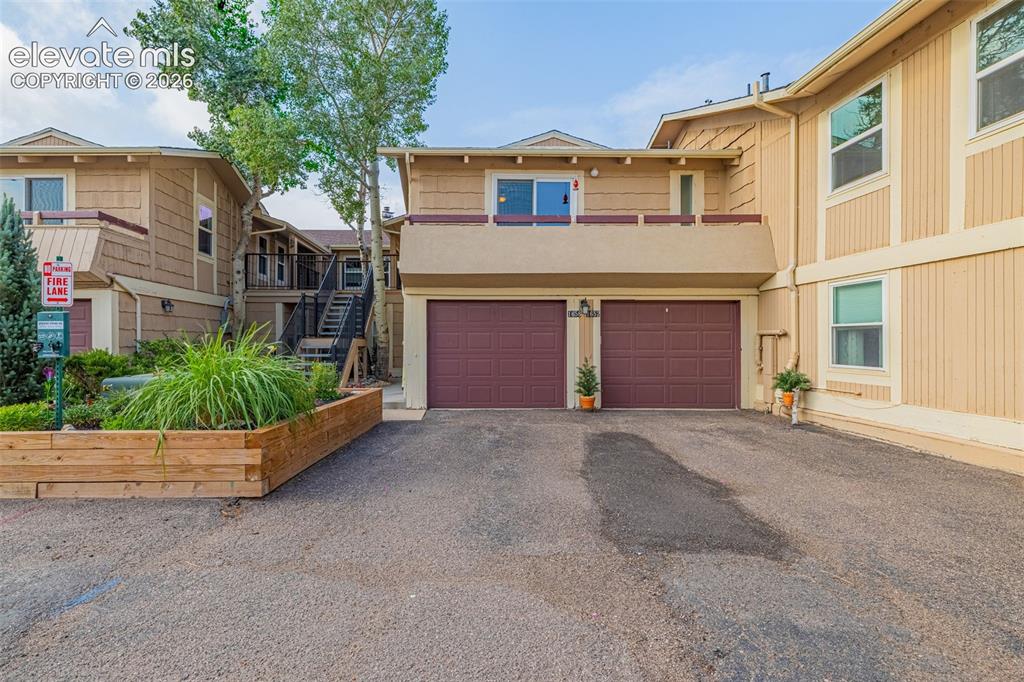 Image 2 of 21: Upper level condo with 1 car garage