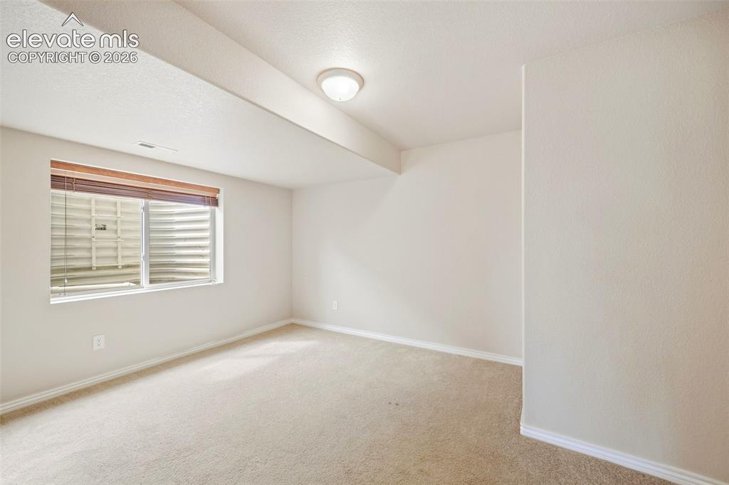 Image 18 of 40: Basement bedroom