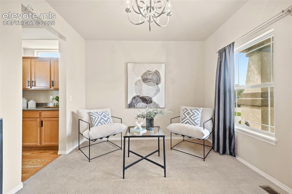 Image 4 of 40: Dining Room/office right off the entrance