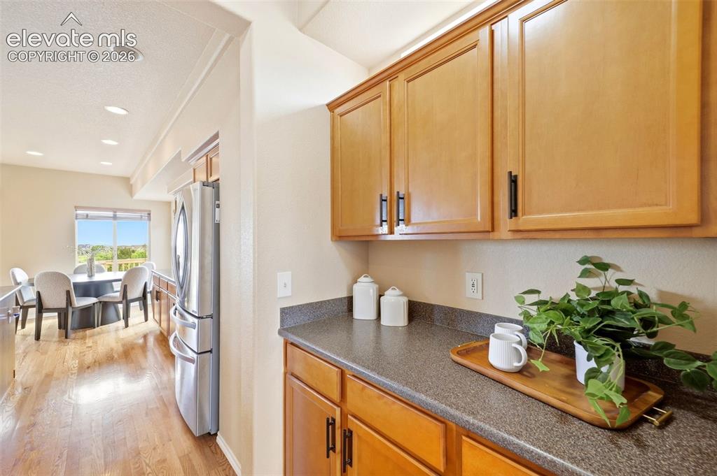 Image 5 of 40: Eat in Kitchen with SS appliances, butlers pantry and hard wood flooring