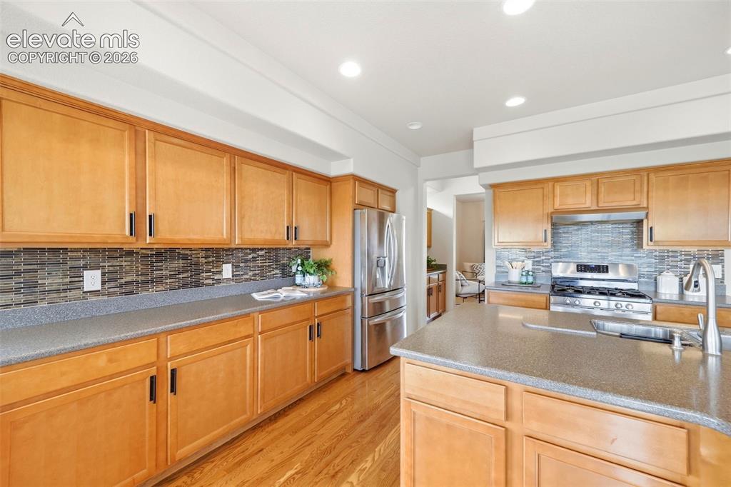 Image 6 of 40: Eat in Kitchen with SS appliances, butlers pantry and hard wood flooring
