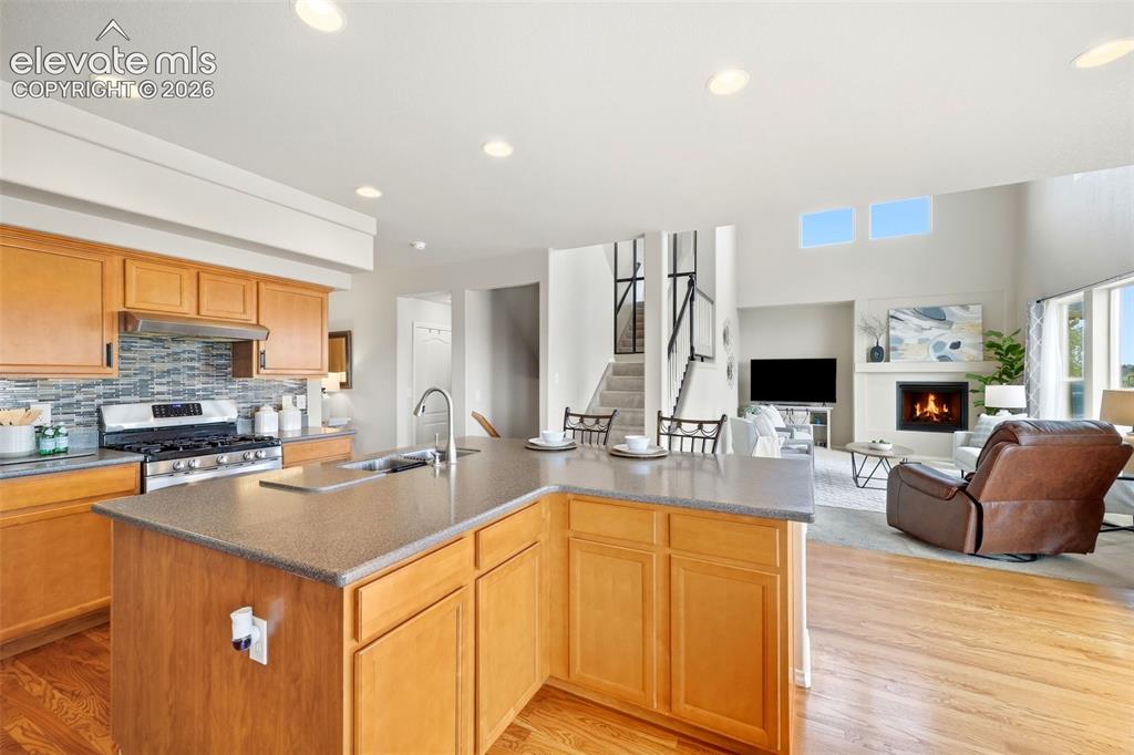 Image 9 of 40: Eat in Kitchen with SS appliances, butlers pantry and hard wood flooring