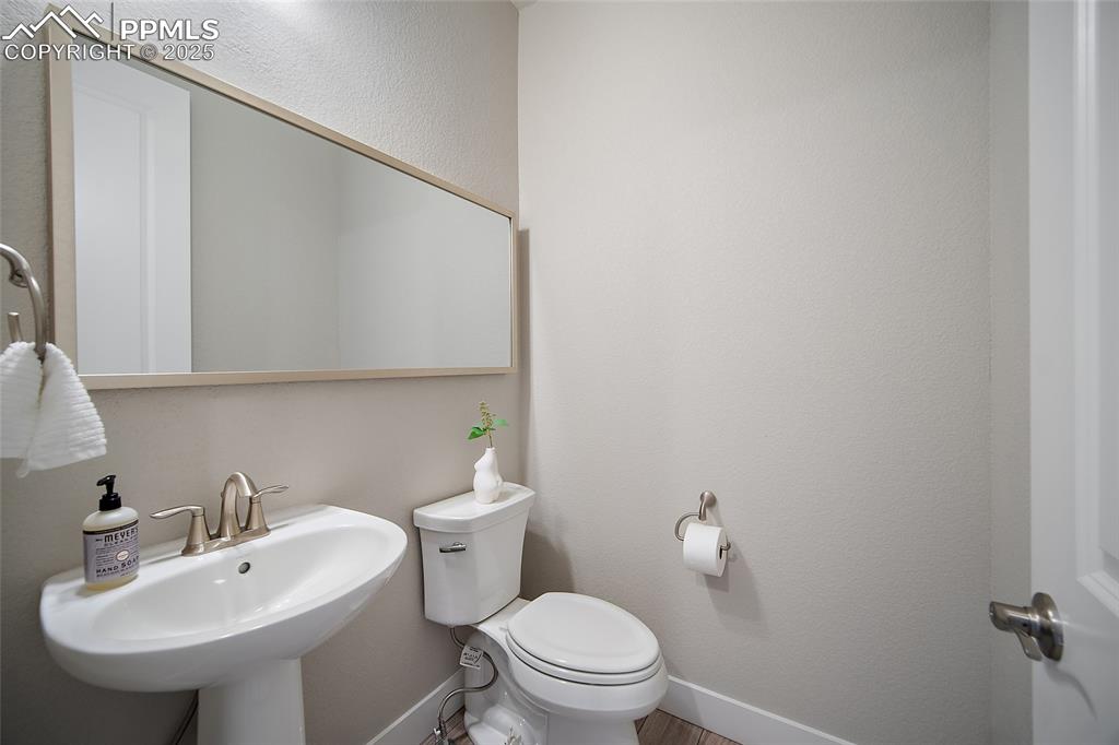 Image 13 of 46: Half bathroom with toilet