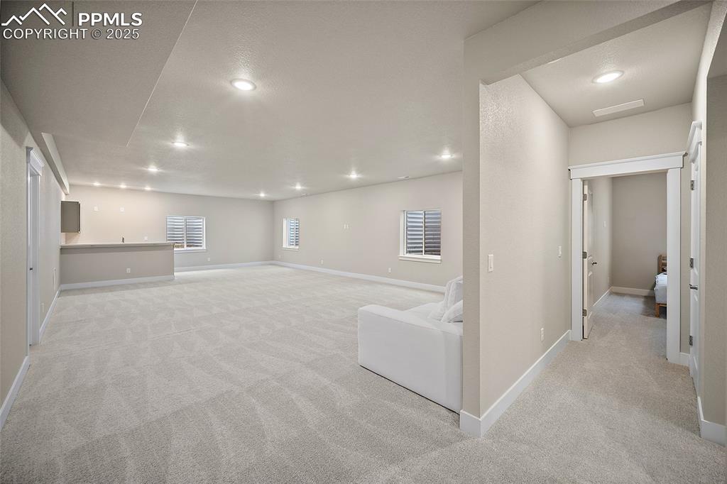 Image 36 of 46: Basement featuring light carpet and recessed lighting