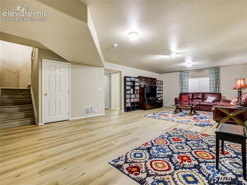 Image 19 of 29: The main level office at the front of the home offers flexible living space