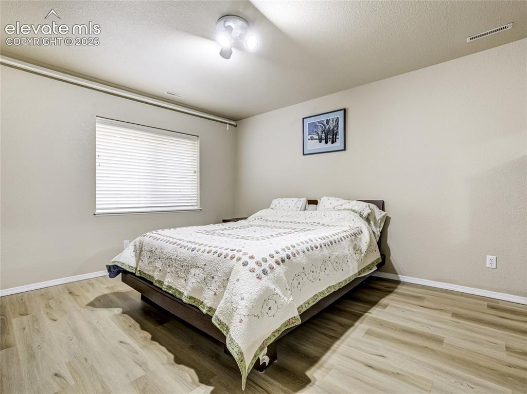 Image 21 of 29: Step down to the spacious lower level designed for entertaining and everyda