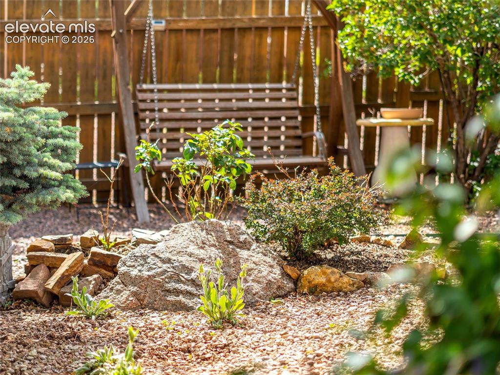 Image 26 of 29: Spacious backyard with room to relax and entertain