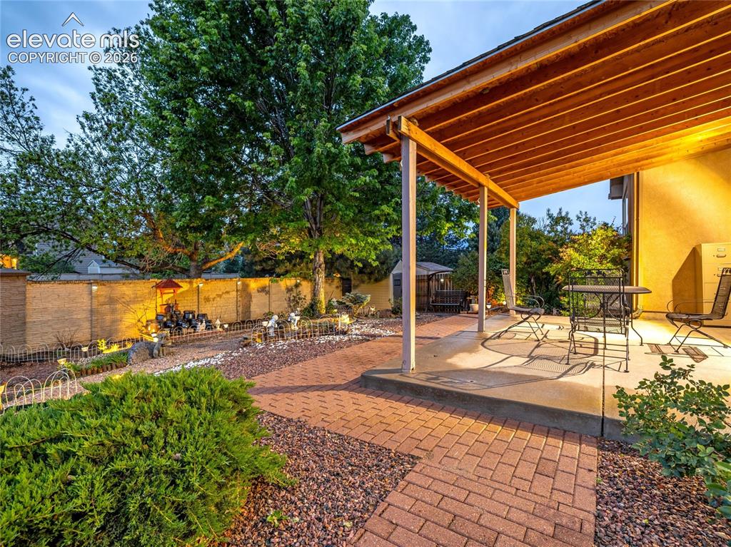 Image 28 of 29: The backyard offers a peaceful setting to enjoy Colorado’s sunshine, changi