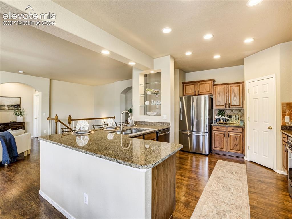 Image 9 of 29: The living room with a gas fireplace offers a warm and comfortable gatherin