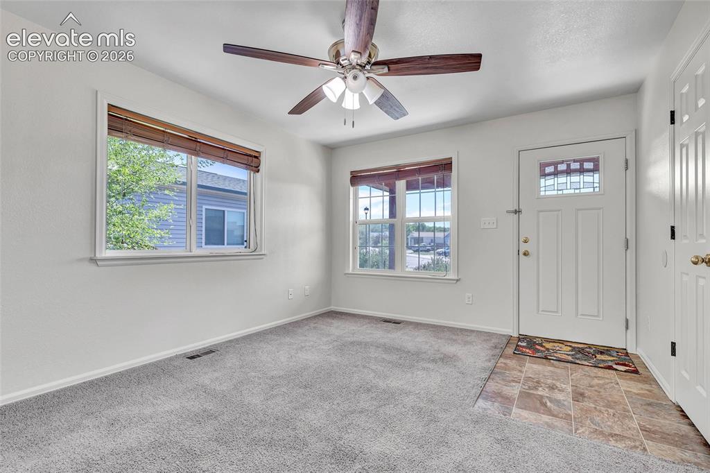 Image 8 of 35: Front entry, living room