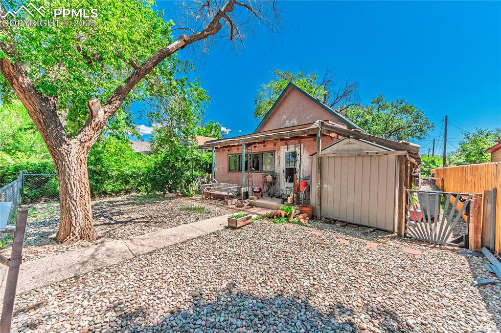 Image 2 of 22: Rear view of property featuring a patio area
