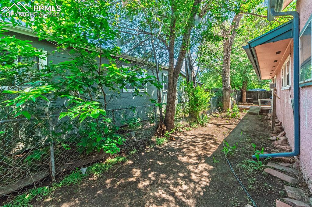 Image 21 of 22: View of fenced backyard