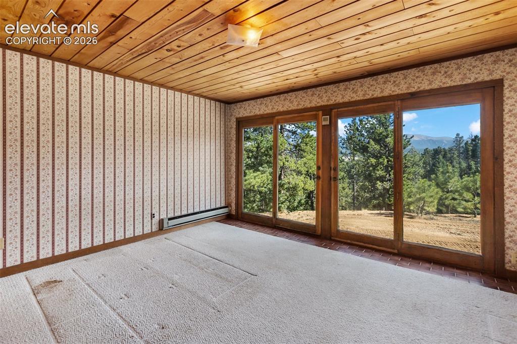 Image 19 of 46: Wood-paneled ceiling with a rectangular ceiling light fixture