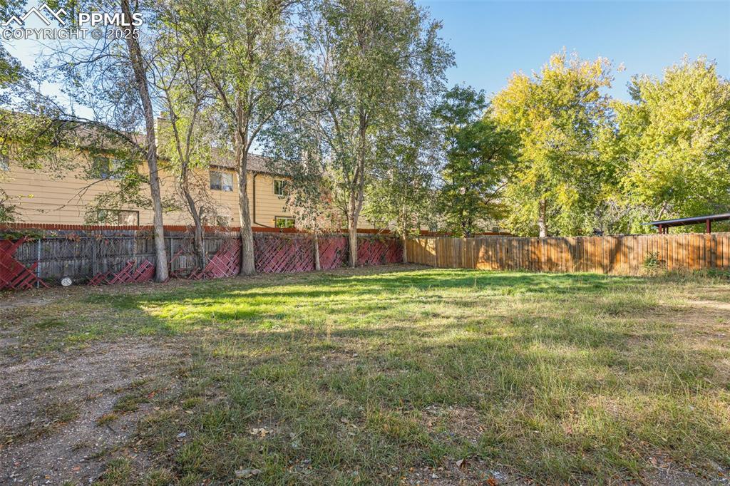 Image 15 of 15: View of fenced backyard
