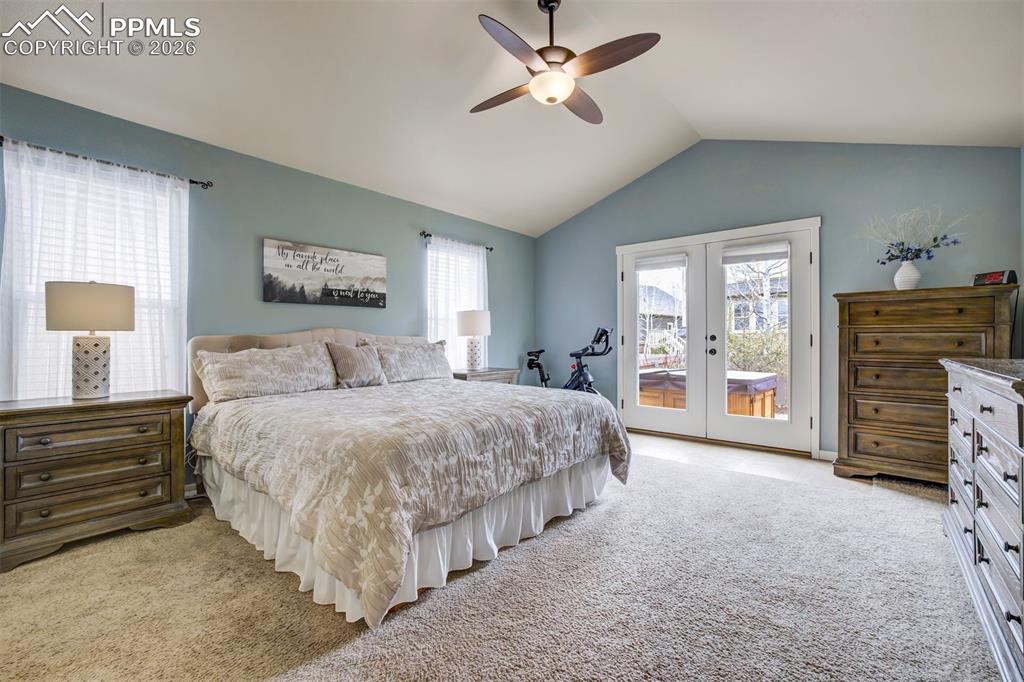 Image 15 of 50: Walk out french doors to the hot tub