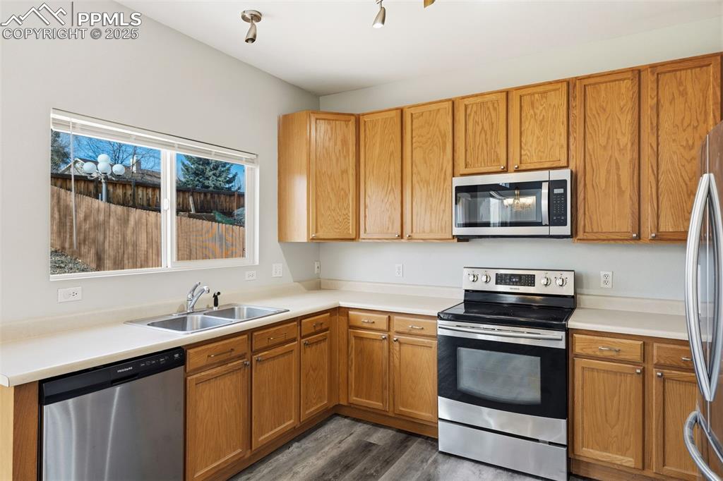 Image 11 of 25: Kitchen with gracious stainless steel appliances