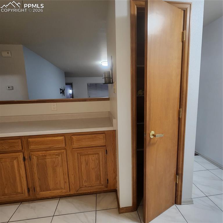 Image 13 of 23: Pantry and kitchen counter