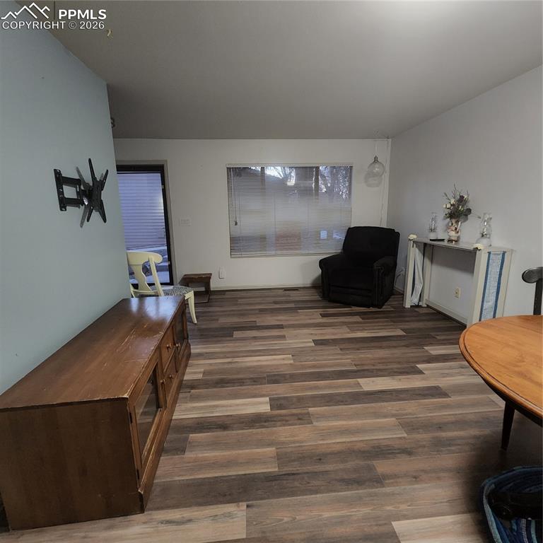 Image 2 of 23: Living area adjoiins front entrance