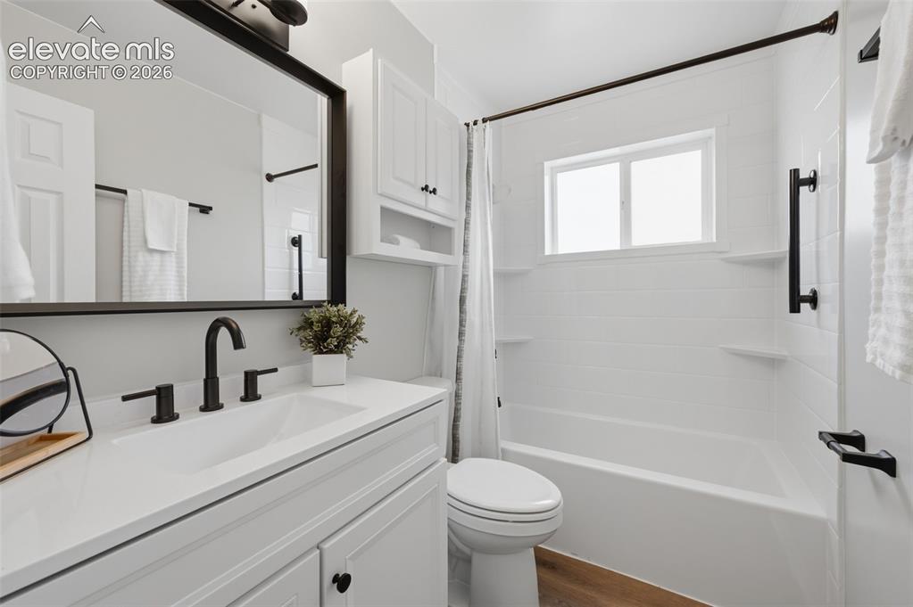Image 19 of 38: Room featuring light wood-finish flooring, white baseboards, and bright whi