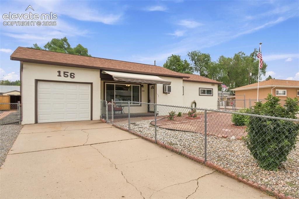 Image 2 of 38: Single-story property with a light-colored exterior and a brown shingle roo