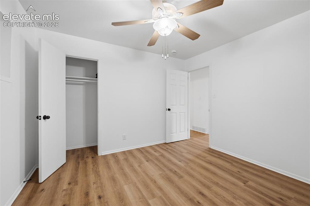 Image 21 of 38: Dedicated utility space featuring carpet flooring and white walls