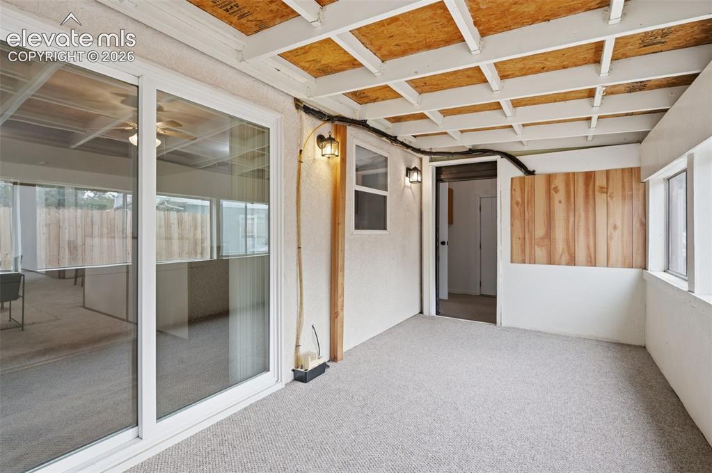 Image 23 of 38: Open-concept living space featuring wood-finish flooring, a ceiling fan wit