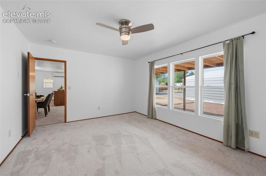 Image 31 of 38: Bathroom featuring a walk-in shower with glass enclosure, white vanity with