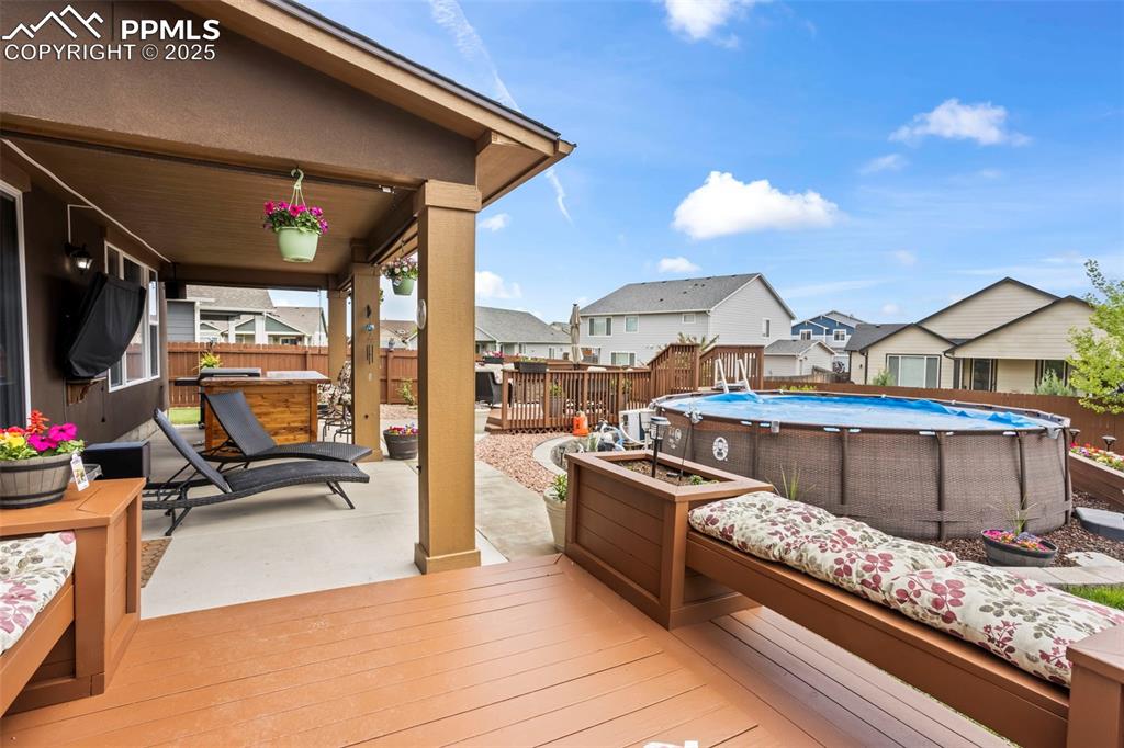 Image 16 of 45: Deck featuring a fenced backyard and a residential view