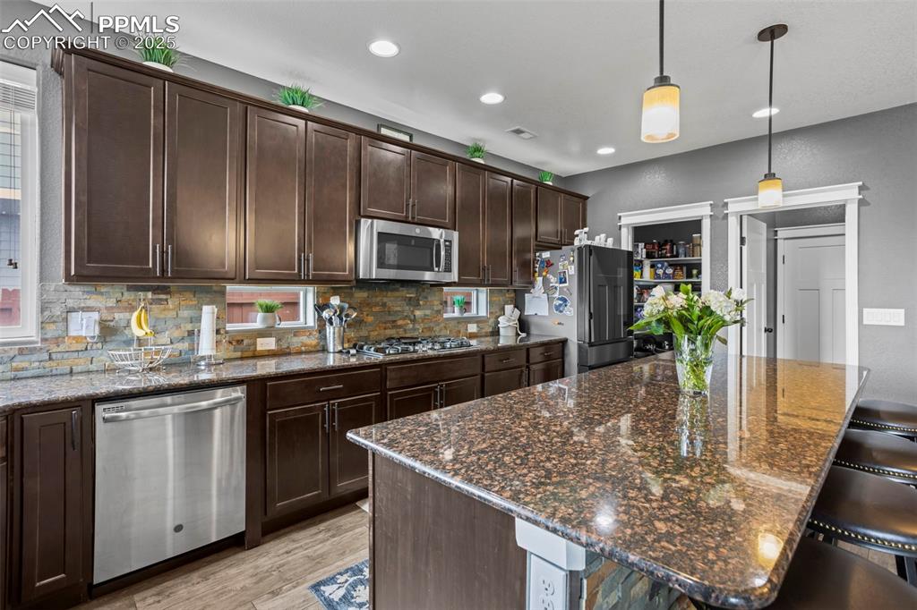Image 25 of 45: Gourmet Kitchen featuring stainless appliances with stainless steel finishe