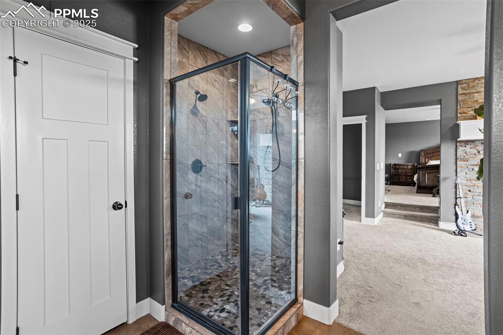 Image 39 of 45: Full bath with baseboards and a custom spa stall shower