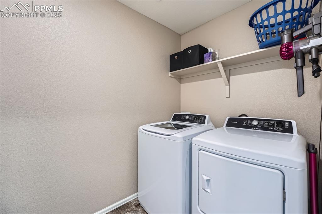 Image 26 of 32: Laundry area featuring independent washer and dryer