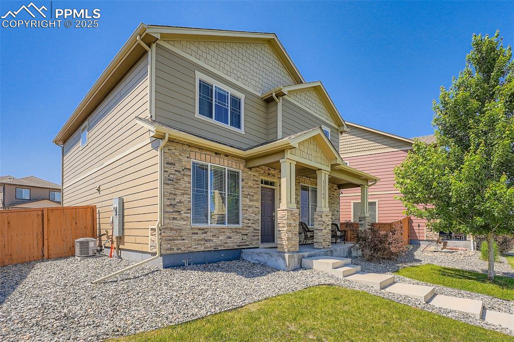 Image 4 of 32: Craftsman inspired home featuring a porch and stone siding