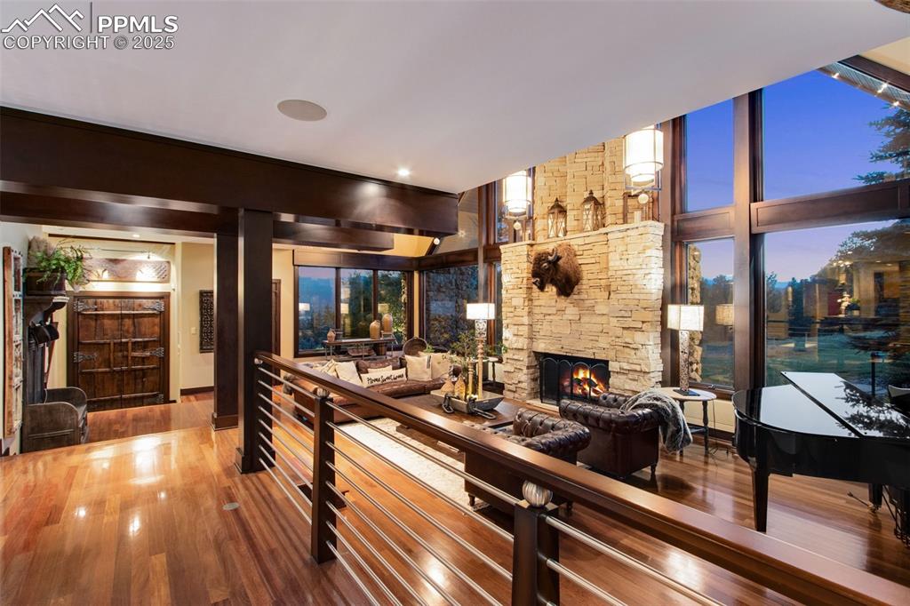 Image 10 of 38: All the materials in this house are luxurious. Stone, exposed wooden beams,