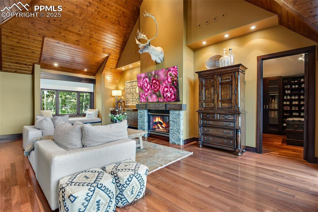 Image 17 of 38: Relax by the fire, read, or watch television in this sitting area. A huge p