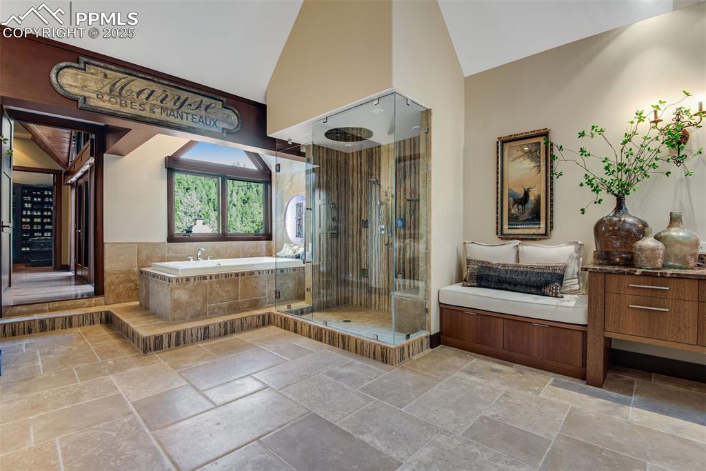 Image 19 of 38: Huge ensuite primary bathroom with deluxe shower and bathtub for soaking.	