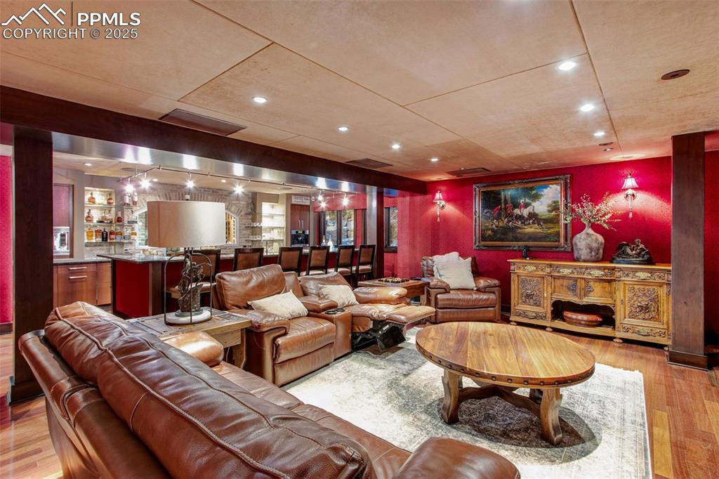 Image 21 of 38: This formal bar and theater room is one of a kind.	