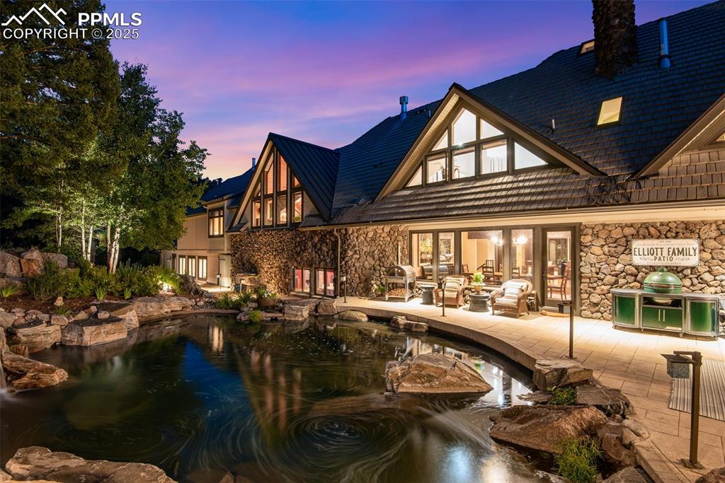 Image 26 of 38: This pond is fed by one of the most fantastic water features you have ever 