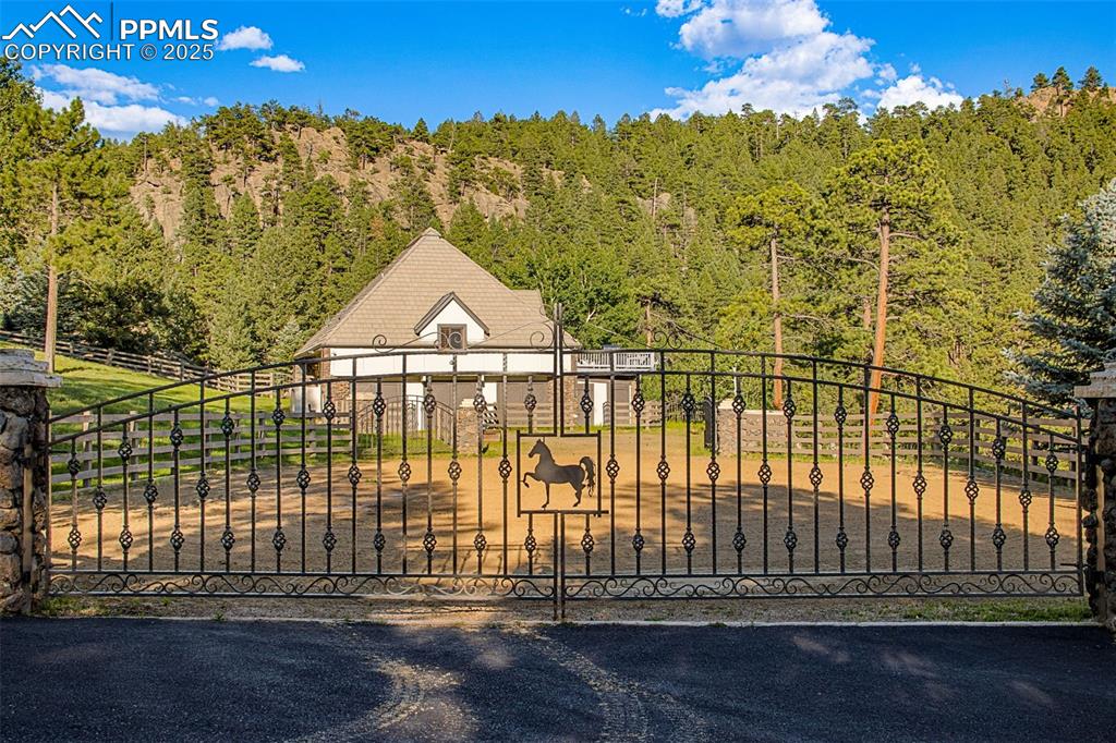 Image 34 of 38: Outside the equestrian center is a riding arena.	